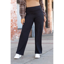 Load image into Gallery viewer, High-waisted black wide leg pants with pockets by Julia Rose, Julia Rose women’s wide leg pants lifestyle image