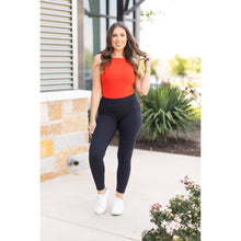 Load image into Gallery viewer, High-waisted black ankle length leggings with pockets by Julia Rose, Julia Rose women’s black 7/8 leggings lifestyle image