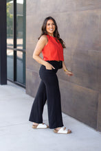 Load image into Gallery viewer, High-waisted black wide leg pants with pockets by Julia Rose, Julia Rose women’s wide leg pants lifestyle image