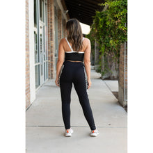 Load image into Gallery viewer, Women’s black leggings with zebra print panels Stretchy leggings withflattering fit"