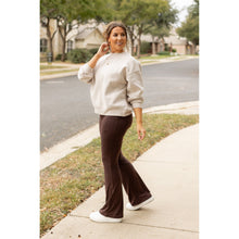 Load image into Gallery viewer, High-waisted brown bootcut leggings with pockets by Julia Rose, Julia Rose women’s brown flared leggings lifestyle image