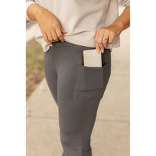 Load image into Gallery viewer, High-waisted charcoal bootcut leggings with pockets by Julia Rose, Julia Rose women’s charcoal flared leggings lifestyle image