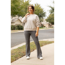 Load image into Gallery viewer, High-waisted charcoal bootcut leggings with pockets by Julia Rose, Julia Rose women’s charcoal flared leggings lifestyle image