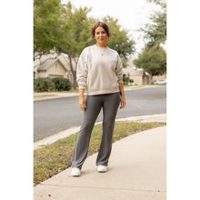 Load image into Gallery viewer, High-waisted charcoal bootcut leggings with pockets by Julia Rose, Julia Rose women’s charcoal flared leggings lifestyle image