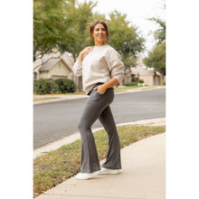 Load image into Gallery viewer, High-waisted charcoal bootcut leggings with pockets by Julia Rose, Julia Rose women’s charcoal flared leggings lifestyle image