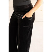 Load image into Gallery viewer, Women’s flowy velvet wide leg holiday pants. Velvet wide leg trousers styled for holiday outfits
