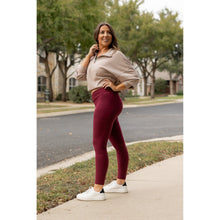 Load image into Gallery viewer, High-waisted maroon crossover leggings with pockets by Julia Rose, Julia Rose women’s maroon full length leggings lifestyle image