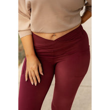 Load image into Gallery viewer, High-waisted maroon crossover leggings with pockets by Julia Rose, Julia Rose women’s maroon full length leggings lifestyle image