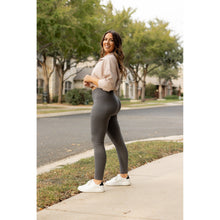 Load image into Gallery viewer, High-waisted charcoal crossover leggings with pockets by Julia Rose, Julia Rose women’s charcoal full length leggings lifestyle image