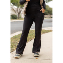 Load image into Gallery viewer, High-waisted black bootcut leggings by Julia Rose, Julia Rose women’s flared black leggings lifestyle image