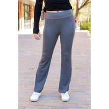 Load image into Gallery viewer, High-waisted charcoal bootcut leggings with pockets by Julia Rose, Julia Rose women’s charcoal flared leggings lifestyle image