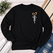 Load image into Gallery viewer, Black long sleeve crew neck tee with God heart front graphic and Way Maker leopard cross faith graphic on back