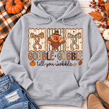 Load image into Gallery viewer, Gobble Gobble Till You Wobble Thanksgiving graphic apparel featuring a cute turkey, polka dot bows, retro fall colors, pumpkins and autumn leaves.
