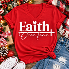 Load image into Gallery viewer, Faith Over Fear Christian inspirational graphic apparel featuring bold white Faith lettering, elegant Over Fear script, a small heart, and a cross design. Available in red and black in short sleeve crewneck, long sleeve crewneck, crewneck sweatshirt, and hoodie styles. Faith-based graphic clothing for women, everyday wear, church outfits, and inspirational gifts.