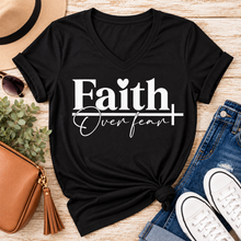 Load image into Gallery viewer, Faith Over Fear Christian inspirational graphic apparel featuring bold white Faith lettering, elegant Over Fear script, a small heart, and a cross design. Available in red and black in short sleeve crewneck, long sleeve crewneck, crewneck sweatshirt, and hoodie styles. Faith-based graphic clothing for women, everyday wear, church outfits, and inspirational gifts.