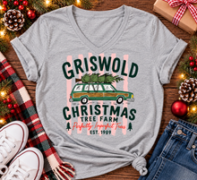 Load image into Gallery viewer, Christmas graphic tee featuring Griswold Christmas Tree Farm vintage green station wagon with Christmas tree and retro lettering.