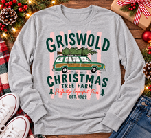 Load image into Gallery viewer, Christmas graphic tee featuring Griswold Christmas Tree Farm vintage green station wagon with Christmas tree and retro lettering.