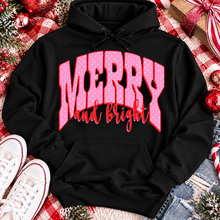 Load image into Gallery viewer, Merry and Bright Christmas graphic apparel with oversized pink polka dot lettering and festive holiday design