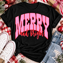 Load image into Gallery viewer, Merry and Bright Christmas graphic apparel with oversized pink polka dot lettering and festive holiday design