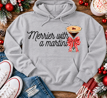 Load image into Gallery viewer, Merrier with a Martini holiday graphic apparel mockup.