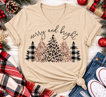 Load image into Gallery viewer, Merry and Bright Christmas graphic apparel featuring leopard print, buffalo plaid and glitter-inspired gold Christmas trees, available in three colors and four styles including crewneck tee, V-neck tee, sweatshirt and hoodie.
