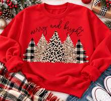 Load image into Gallery viewer, Merry and Bright Christmas graphic apparel featuring leopard print, buffalo plaid and glitter-inspired gold Christmas trees, available in three colors and four styles including crewneck tee, V-neck tee, sweatshirt and hoodie.