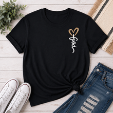 Load image into Gallery viewer, Front: Black Christian graphic tee featuring a small white Jesus script design with a brown heart on the front chest.