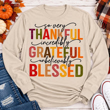 Load image into Gallery viewer, Thankful Grateful Blessed fall graphic long sleeve crewneck tee with colorful autumn lettering
