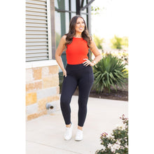 Load image into Gallery viewer, High-waisted black ankle length leggings with pockets by Julia Rose, Julia Rose women’s black 7/8 leggings lifestyle image
