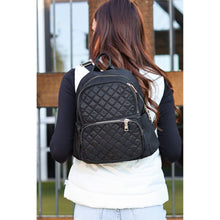 Load image into Gallery viewer, black quilted backpack with gold zipper detail worn by woman stylish everyday backpack
