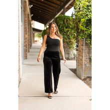 Load image into Gallery viewer, Women’s flowy velvet wide leg holiday pants. Velvet wide leg trousers styled for holiday outfits
