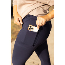 Load image into Gallery viewer, High-waisted navy crossover leggings with pockets by Julia Rose, Julia Rose women’s navy full length leggings lifestyle image
