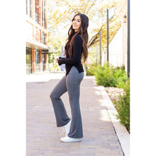 Load image into Gallery viewer, High-waisted charcoal bootcut leggings with pockets by Julia Rose, Julia Rose women’s charcoal flared leggings lifestyle image
