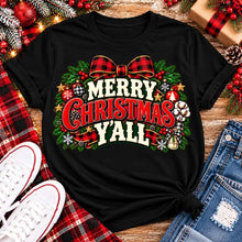 Load image into Gallery viewer, Merry Christmas Y'all graphic apparel featuring vintage red, green, and cream lettering with a festive buffalo plaid bow, Christmas ornaments, pine greenery, and rustic holiday decorations. Southern Christmas graphic available in two colors and four styles, including short sleeve crewneck, V-neck, long sleeve, and hoodie.
