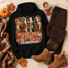 Load image into Gallery viewer, Pumpkin Patch Moms apparel with three skeleton moms, pumpkins and the phrase Fueled by Caffeine and Chaos, available in sizes S–3XL.
