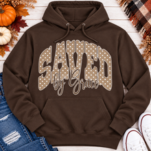 Load image into Gallery viewer, Saved by Grace faith graphic apparel with polka dot lettering, available in brown, navy and black V-neck, long sleeve, crewneck and hoodie styles.
