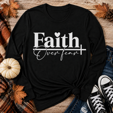 Load image into Gallery viewer, Julia Rose Faith Over Fear apparel featuring a white heart and cross design, available as a crewneck, V-neck, long-sleeve T-shirt and hoodie.
