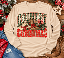 Load image into Gallery viewer, Country Christmas graphic tee with green plaid lettering, red polka dots, cowboy boots, western hat and festive Christmas bows.
