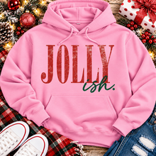 Load image into Gallery viewer, Jolly Ish Christmas graphic shirt featuring large distressed red JOLLY lettering with green handwritten ish script. Funny vintage-inspired holiday apparel available in pink and black, offered in short sleeve crewneck, V-neck, long sleeve and hoodie styles.
