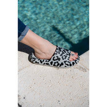 Load image into Gallery viewer, Gray leopard-print beach slides with a bold spotted pattern and easy slip-on design.
