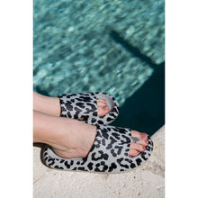 Load image into Gallery viewer, Gray leopard-print beach slides with a bold spotted pattern and easy slip-on design.
