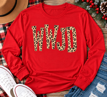 Load image into Gallery viewer, shirt with tan leopard-print WWJD lettering in a rustic holiday flat lay.
