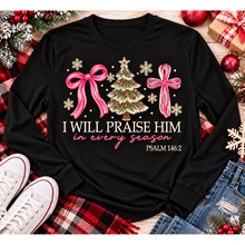 Load image into Gallery viewer, Christian Christmas shirt featuring I Will Praise Him in Every Season Psalm 146:2 graphic with pink bows, decorated Christmas tree, and cream snowflakes.
