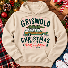 Load image into Gallery viewer, Christmas graphic tee featuring Griswold Christmas Tree Farm vintage green station wagon with Christmas tree and retro lettering.
