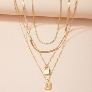 Gold Initial Letter and Lock Multi Layer Necklace in Gold Setting