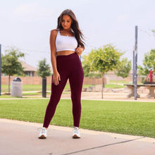 Load image into Gallery viewer, High-waisted maroon crossover leggings with pockets by Julia Rose, Julia Rose women’s maroon full length leggings lifestyle image
