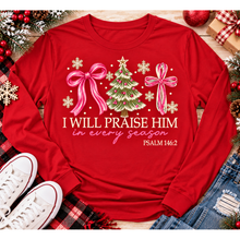 Load image into Gallery viewer, Christian Christmas shirt featuring I Will Praise Him in Every Season Psalm 146:2 graphic with pink bows, decorated Christmas tree, and cream snowflakes.
