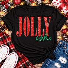 Load image into Gallery viewer, Jolly Ish Christmas graphic shirt featuring large distressed red JOLLY lettering with green handwritten ish script. Funny vintage-inspired holiday apparel available in pink and black, offered in short sleeve crewneck, V-neck, long sleeve and hoodie styles.
