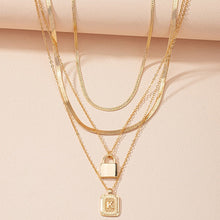 Load image into Gallery viewer, Gold Initial Letter and Lock Multi Layer Necklace in Gold Setting
