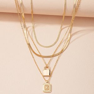 Gold Initial Letter and Lock Multi Layer Necklace in Gold Setting